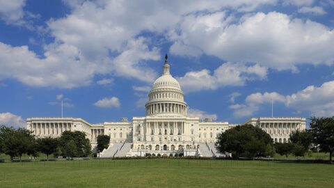 US Capitol building west side under blue sky