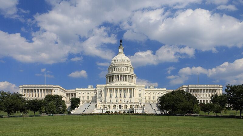 US Capitol building west side under blue sky