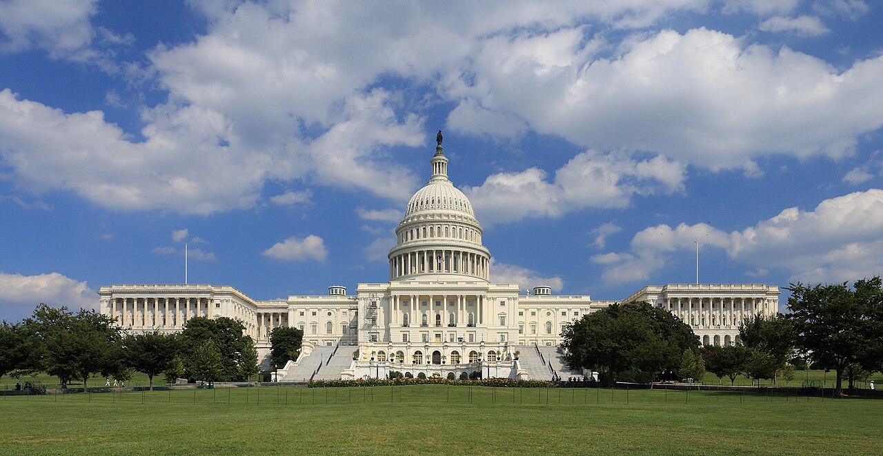 US Capitol building west side under blue sky