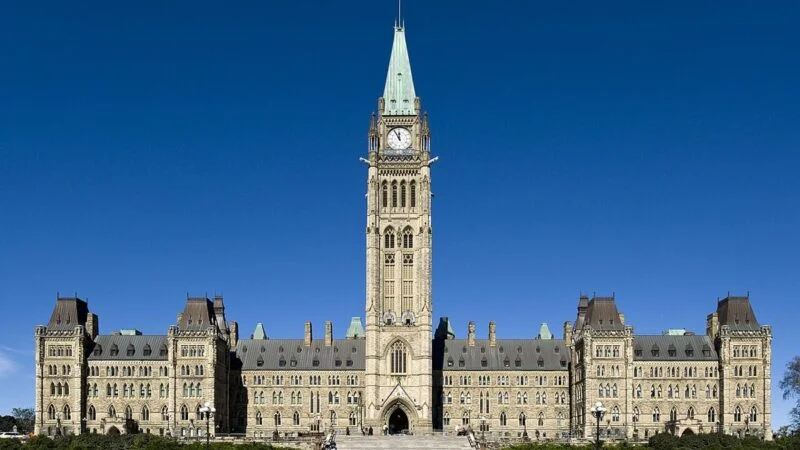 Parliament Hill in Ottawa with the Peace Tower against a blue sky