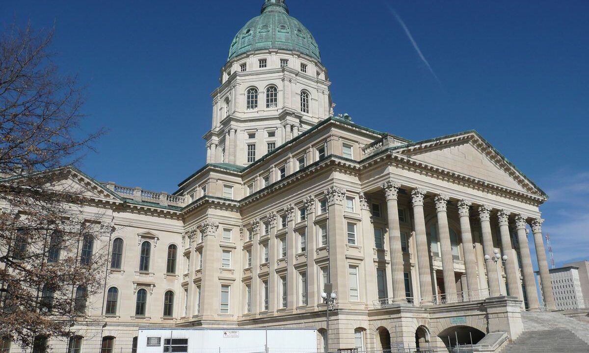 Kansas State Capitol dome and columns under blue sky