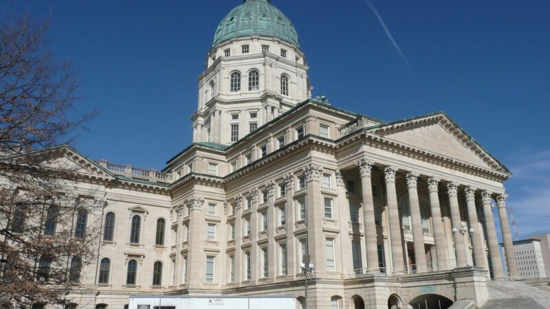 Kansas State Capitol dome and columns under blue sky
